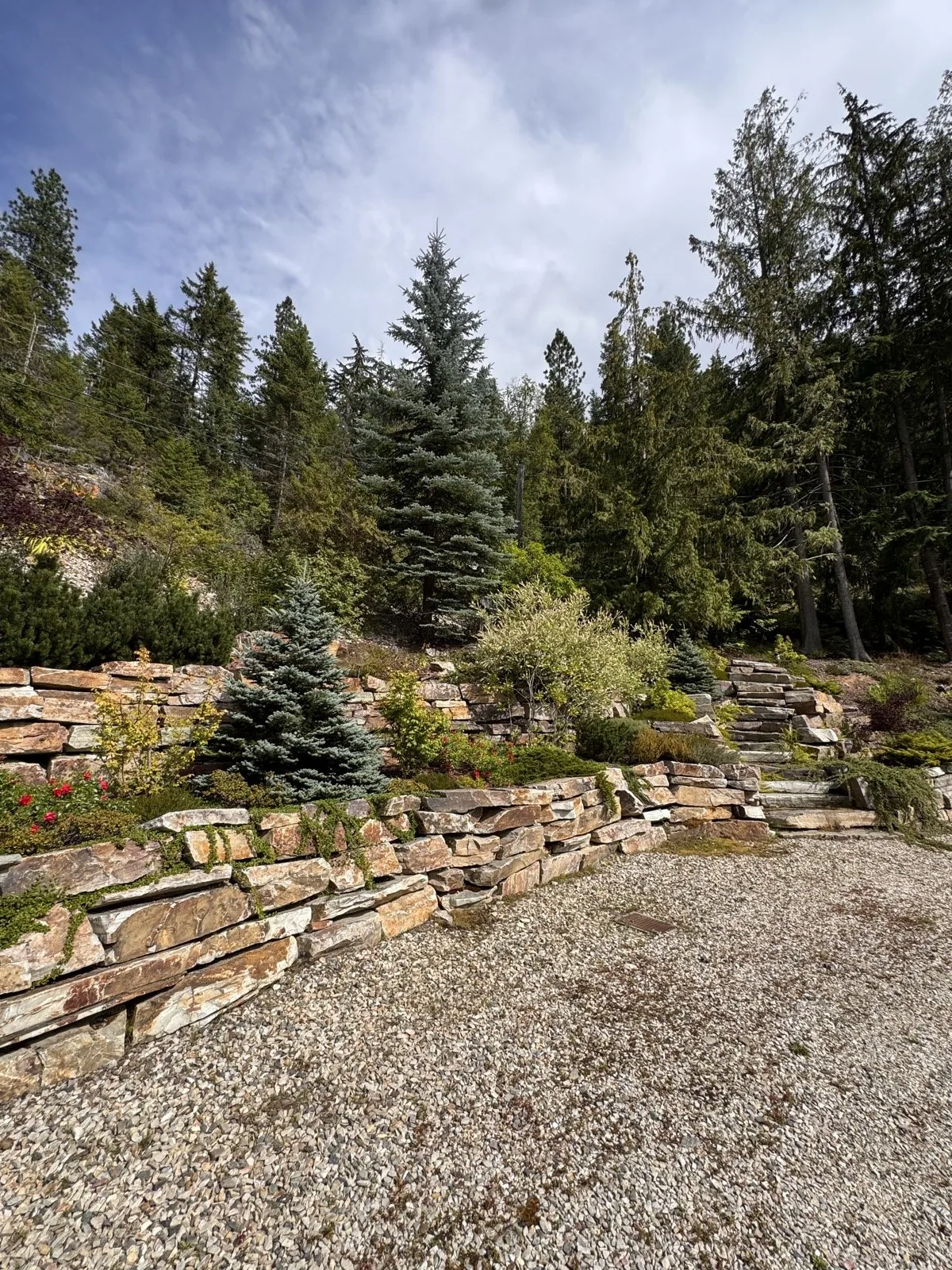 Terraced stone walls with irrigated beds above the gravel pad