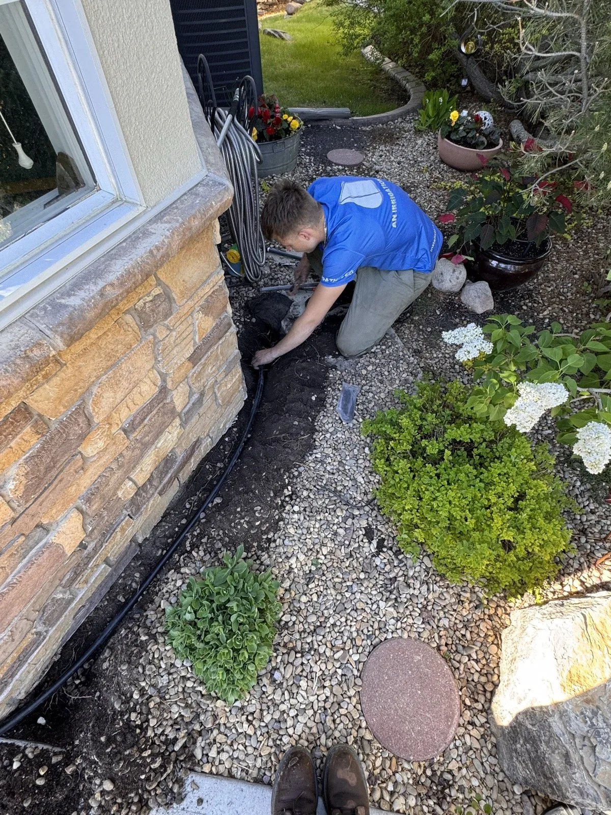 One of our techs working a line in the rock bed at the foundation